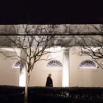 trump walks at the white house
