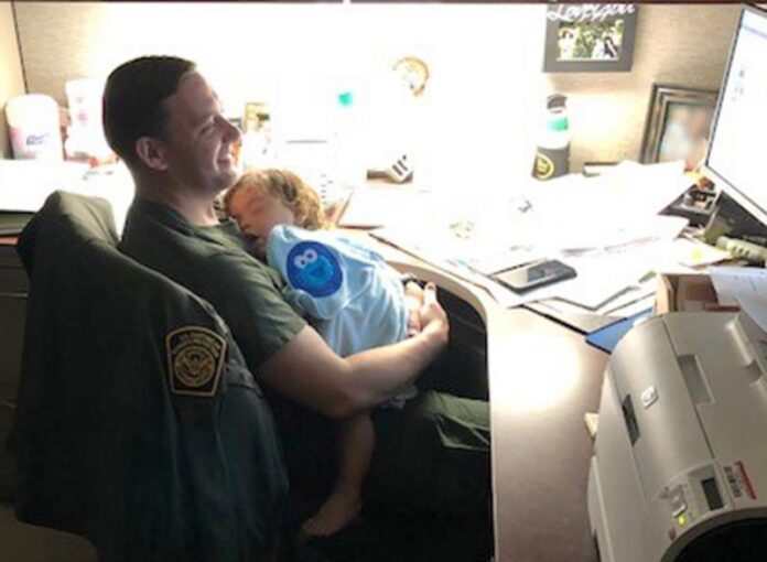 border patrol agents care for baby