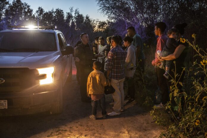 migrants near Los Ebanos, Texas