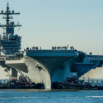 USS George H.W. Bush being moved from Northrop Grumman Shipbuilding in Newport News, Virginia to Naval Station Norfolk, Norfolk, Virginia in preparation for it's commissioning ceremony.