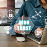 Zero trust security concept, Person using computer with zero trust icon on virtual screen.
