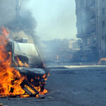 Burning van with large flames and black smoke terrorism