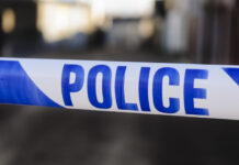 Two Arrested as Police Investigate Attempted Arson at UK Synagogue as Antisemitic Hate Crime uk police, Police tape at the cordon across a crime scene