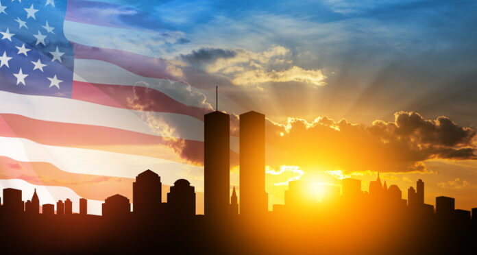 New York skyline silhouette with Twin Towers and USA flag at sunset. 09.11.2001 American Patriot Day banner. NYC World Trade Center.